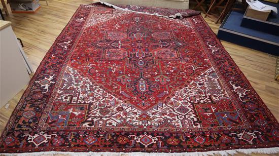 A Heriz ivory ground carpet 400 x 290cm
